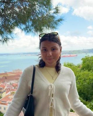 woman standing in front seascape