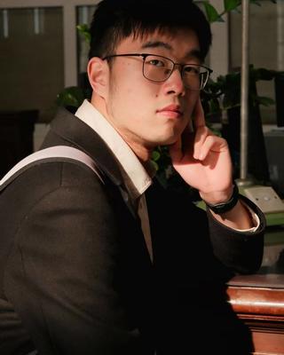 headshot of man with glasses
